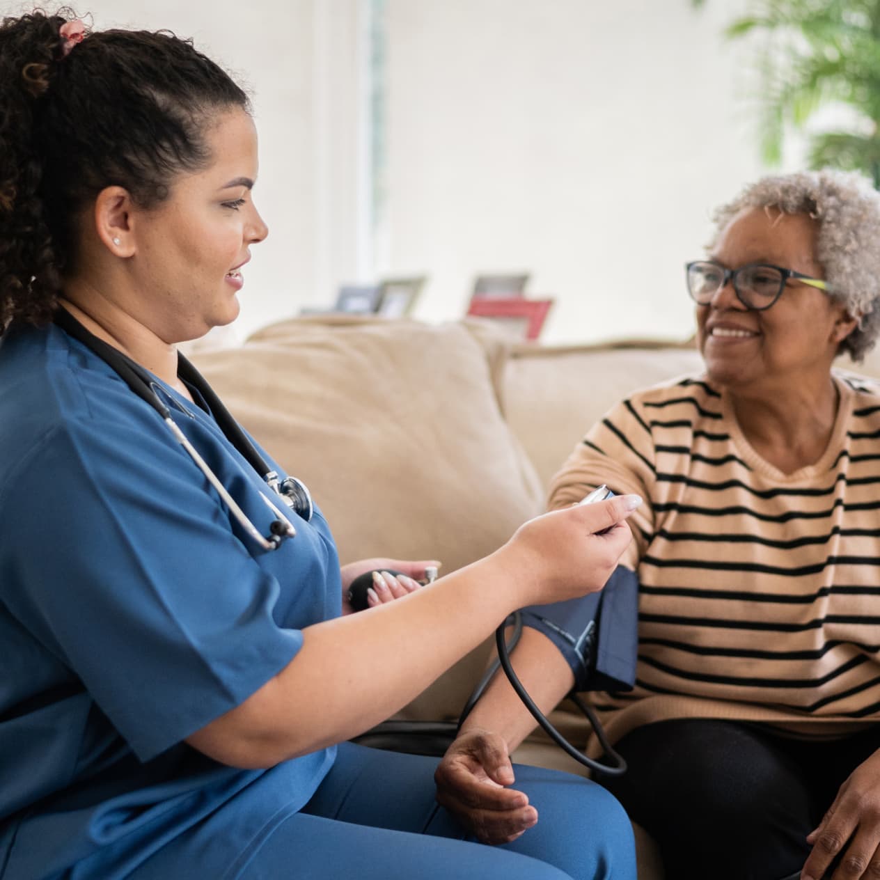 A nurse taking a patient's blood pressure