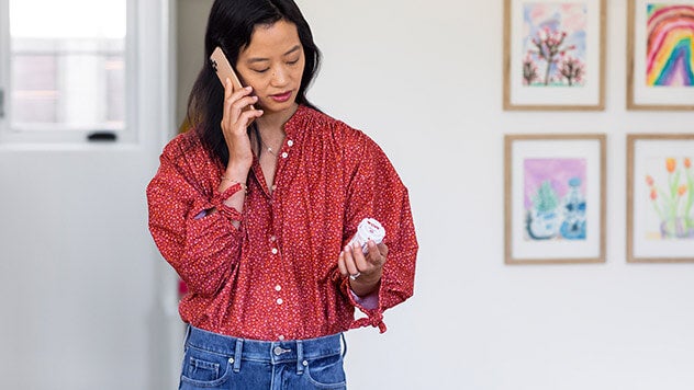 Woman on phone calling in her prescription to pharmacy