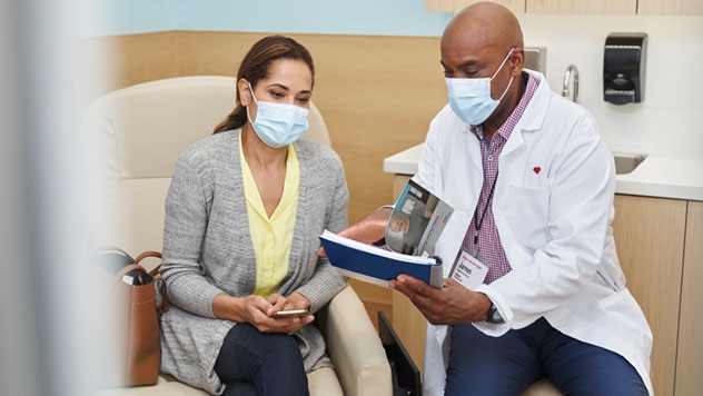 Doctor and patient reviewing material together