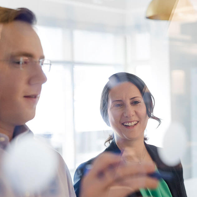 Two people looking at an object