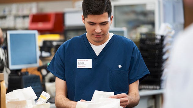 Pharmacist reviewing paperwork