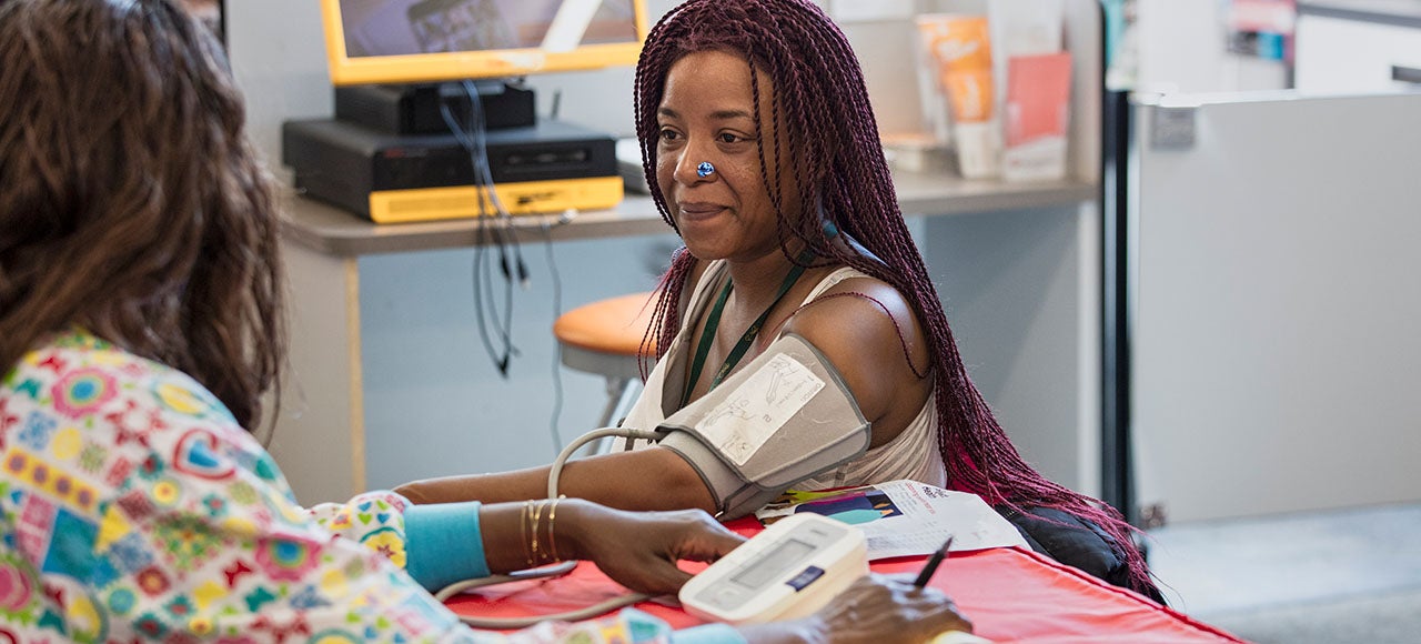 A woman getting her blood pressure taken