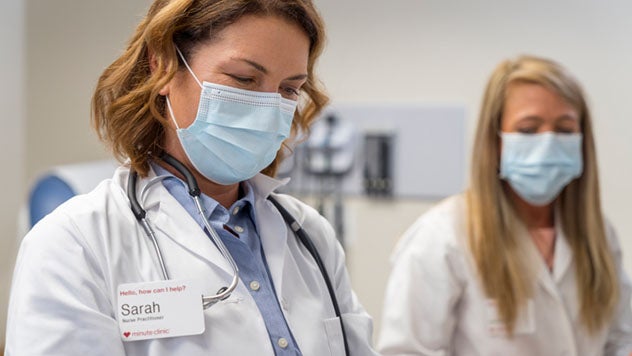 Two female pharmacists working together