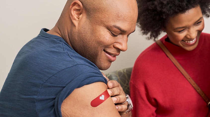 Family of three receives a CVS vaccination