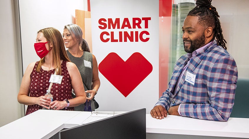 Three people at a CVS Smart Clinic