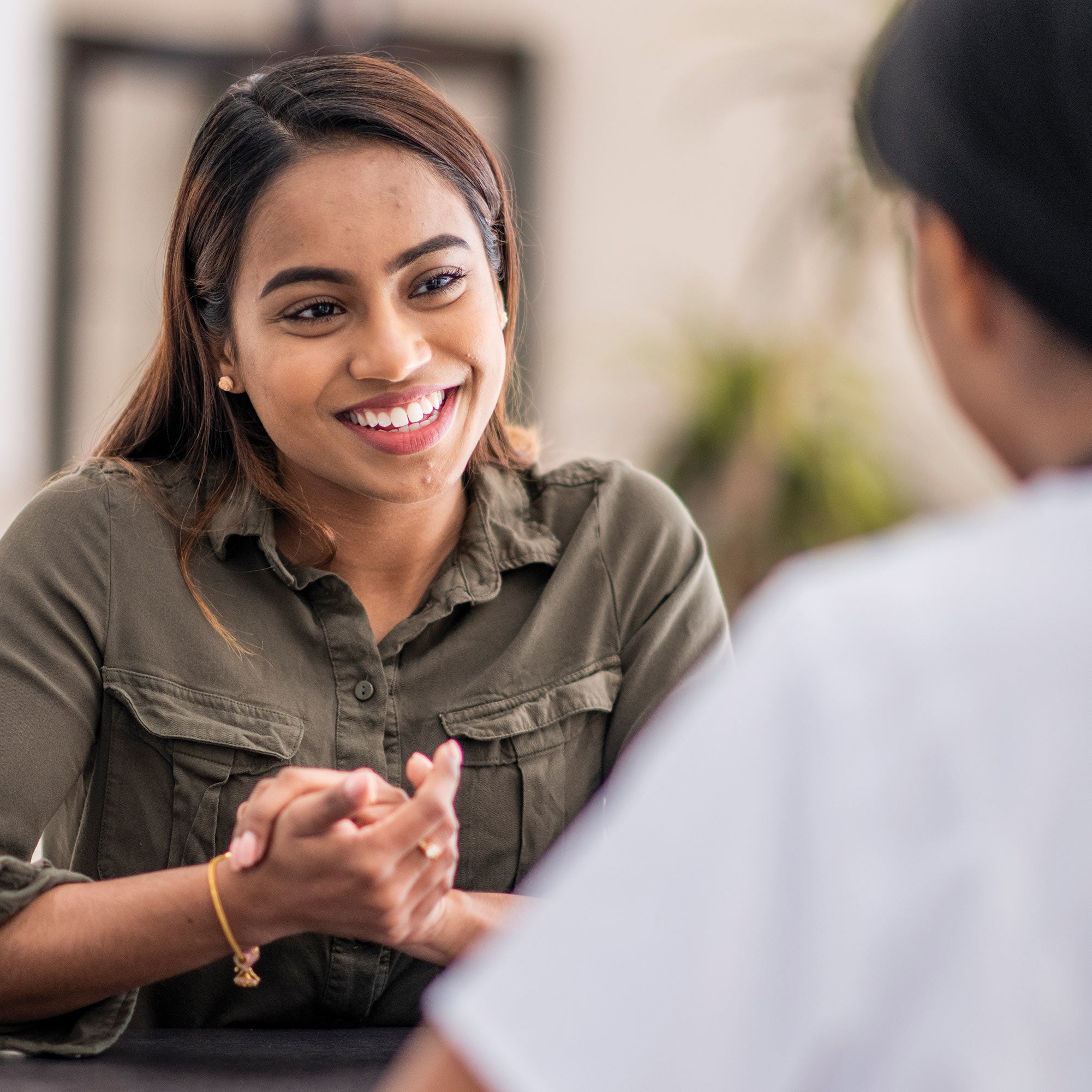 Two women having lively conversation