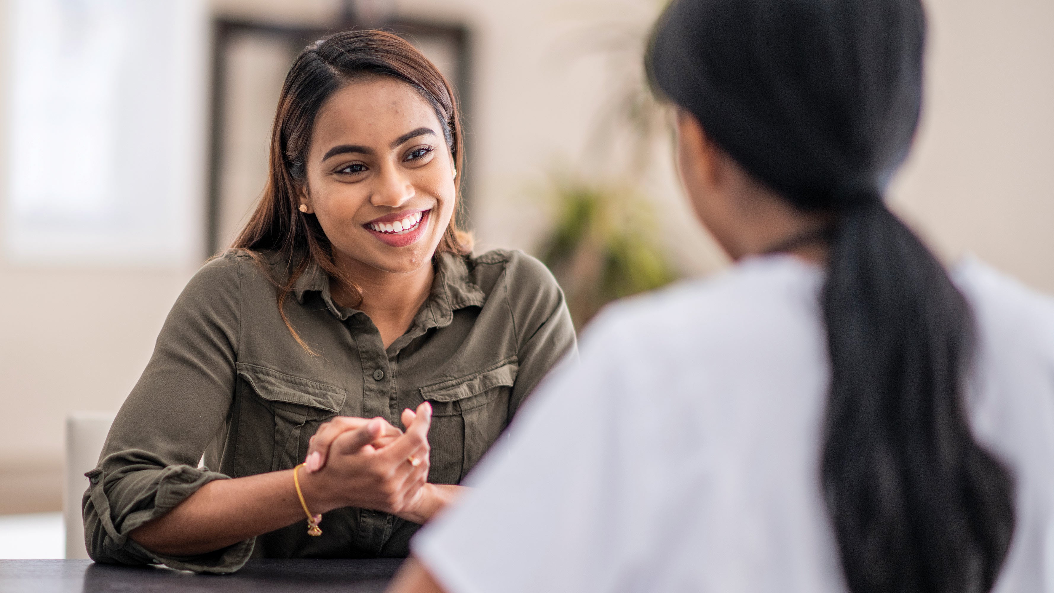 Two women having lively conversation