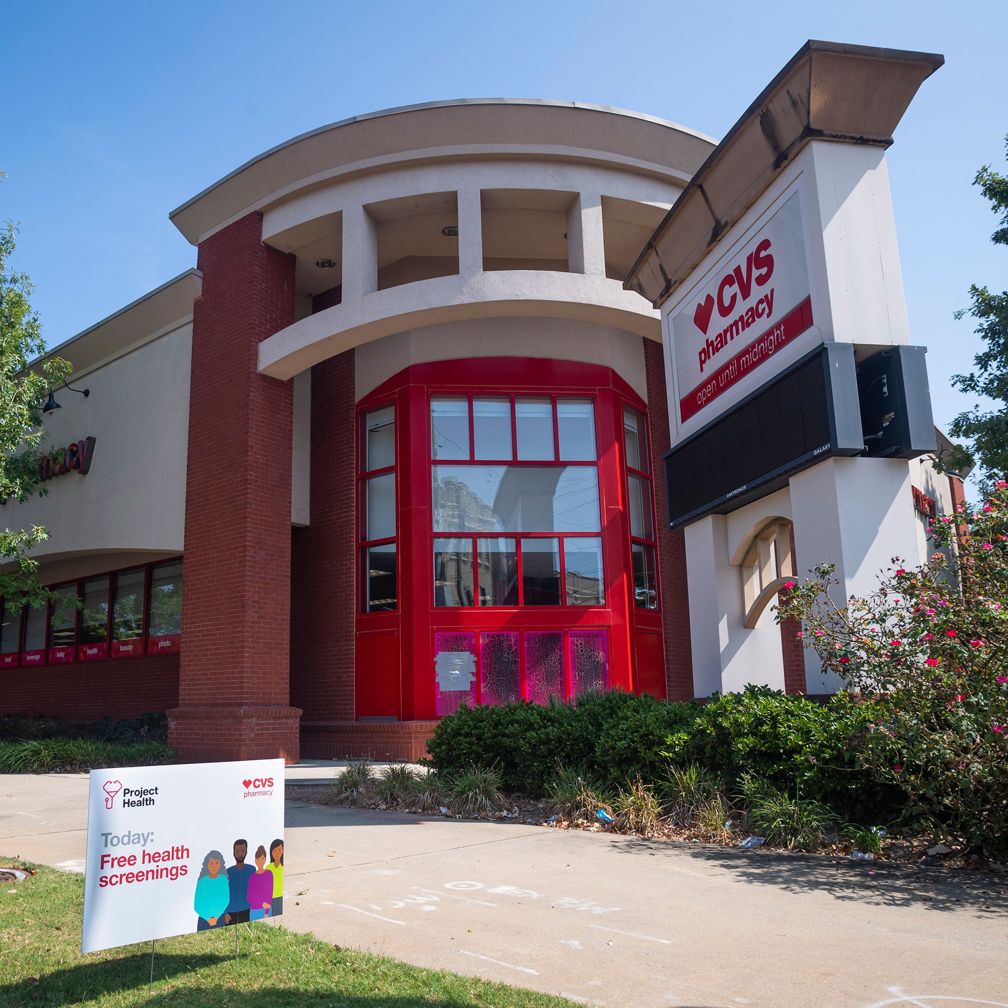 A CVS Pharmacy store with Project Health sign.