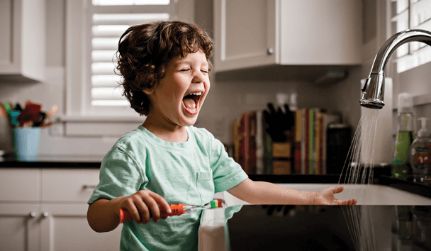 Child brushing teeth