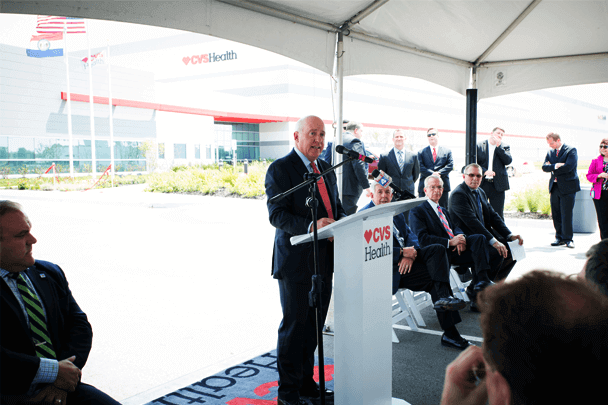 A speaker at the distribution center ribbon cutting.