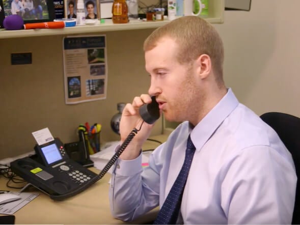 A counselor talking on the phone.