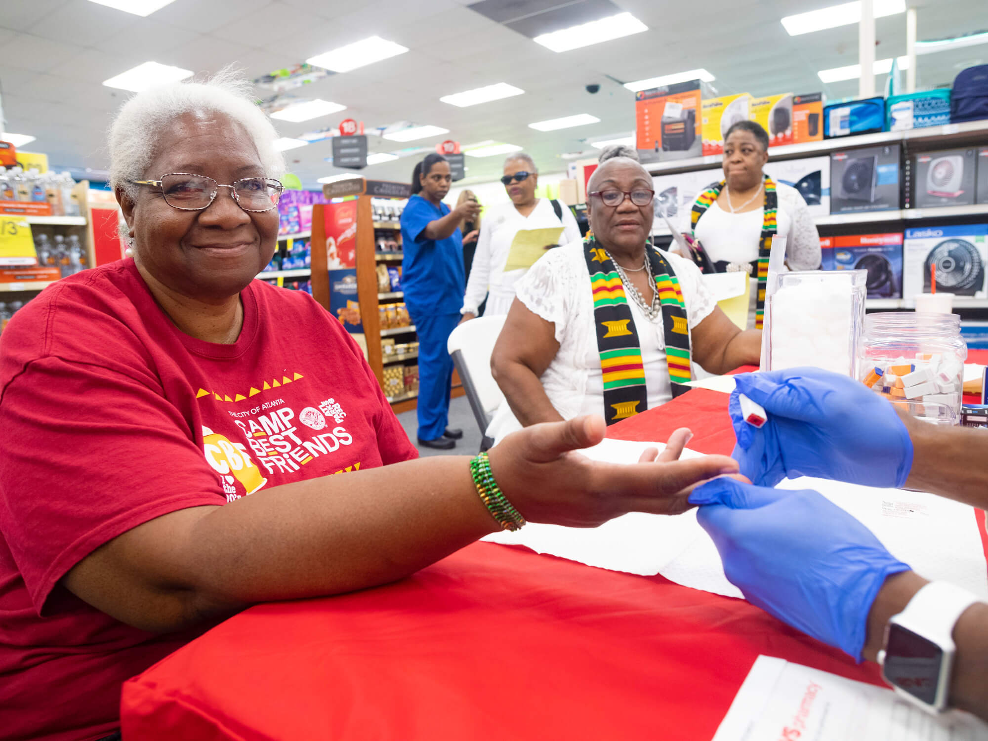 A customer receiving a free health screening.