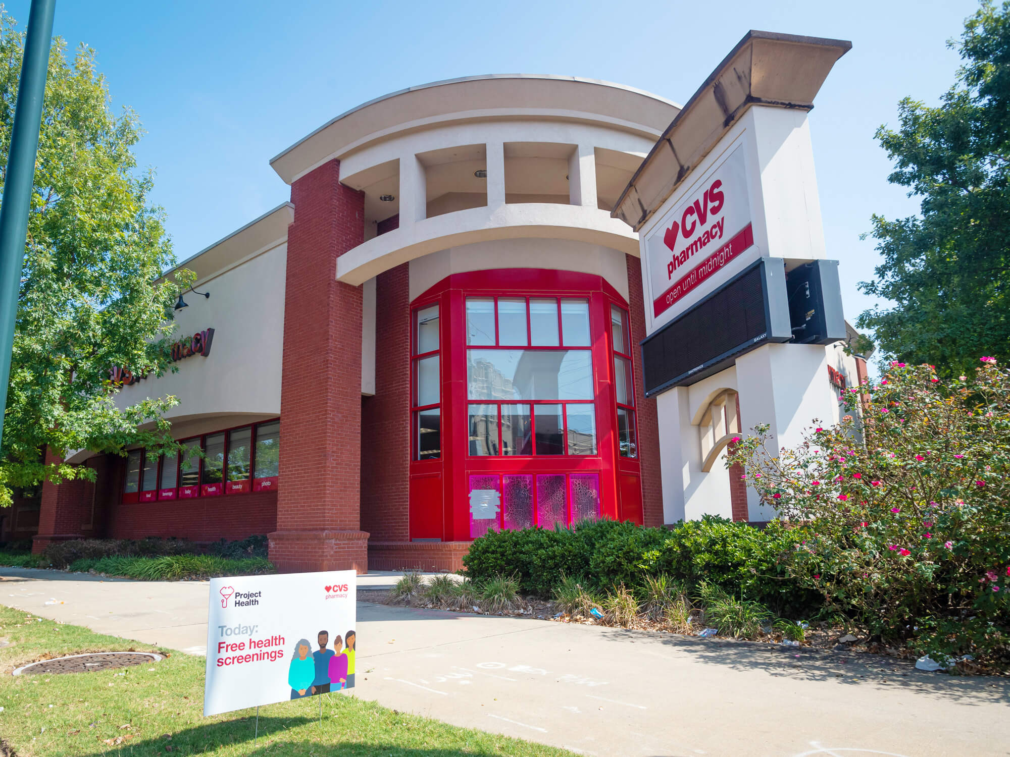 A CVS Pharmacy store with Project Health sign.