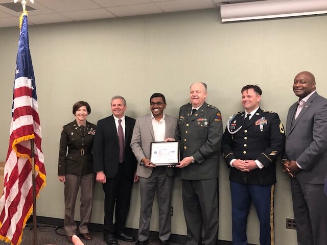 Raja Ramasamy, accepts his Patriot Award from Phil Albert.