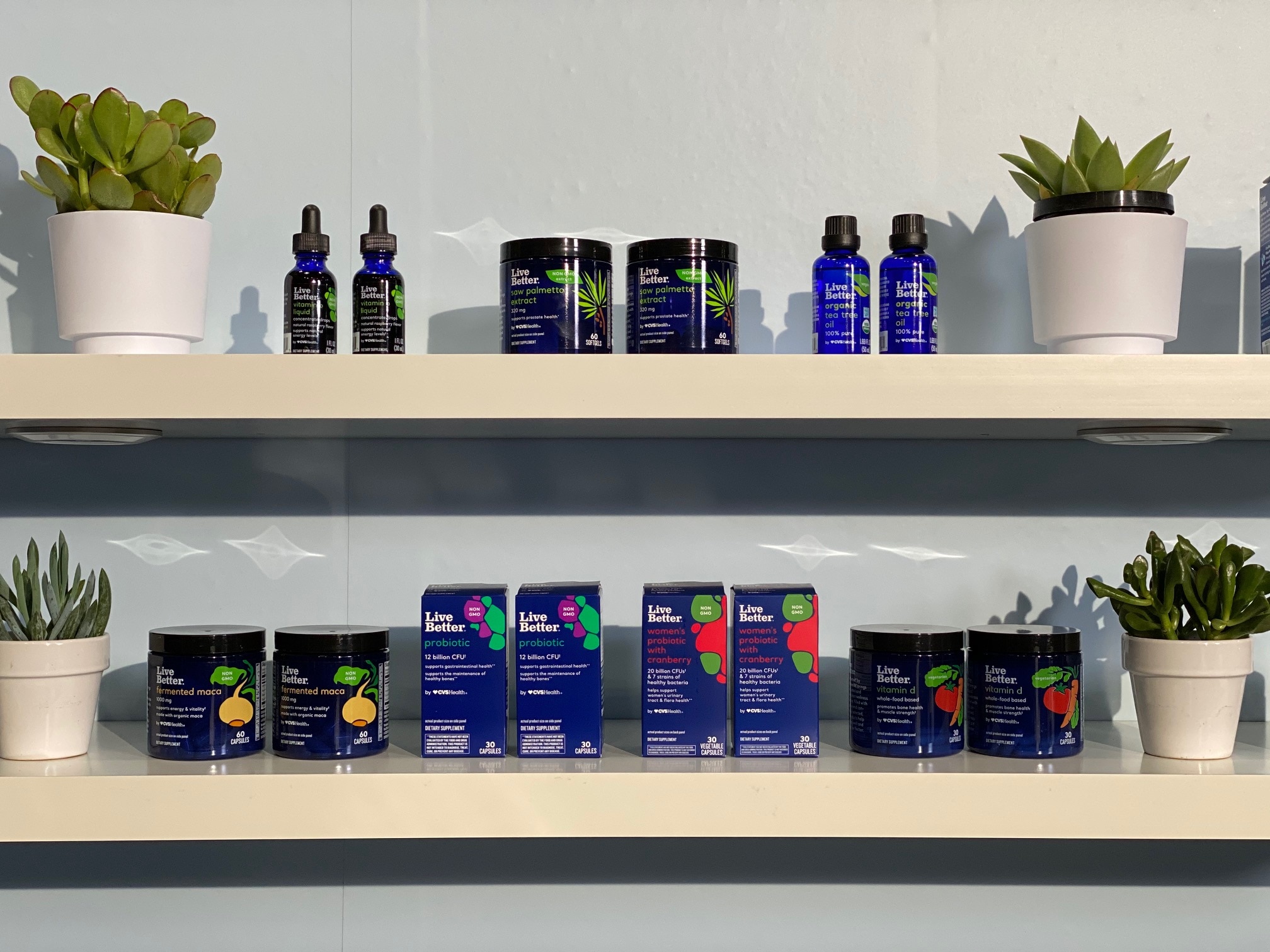 Live Better products on a shelf with cacti.