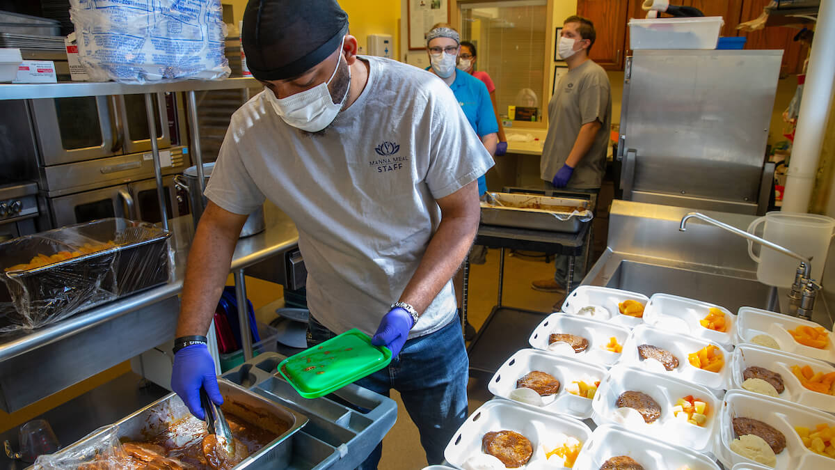 Non-profit soup kitchen Manna Meal, a partner of Unite Us, prepares to serve meals June 4, 2020, in Charleston, West Virginia.