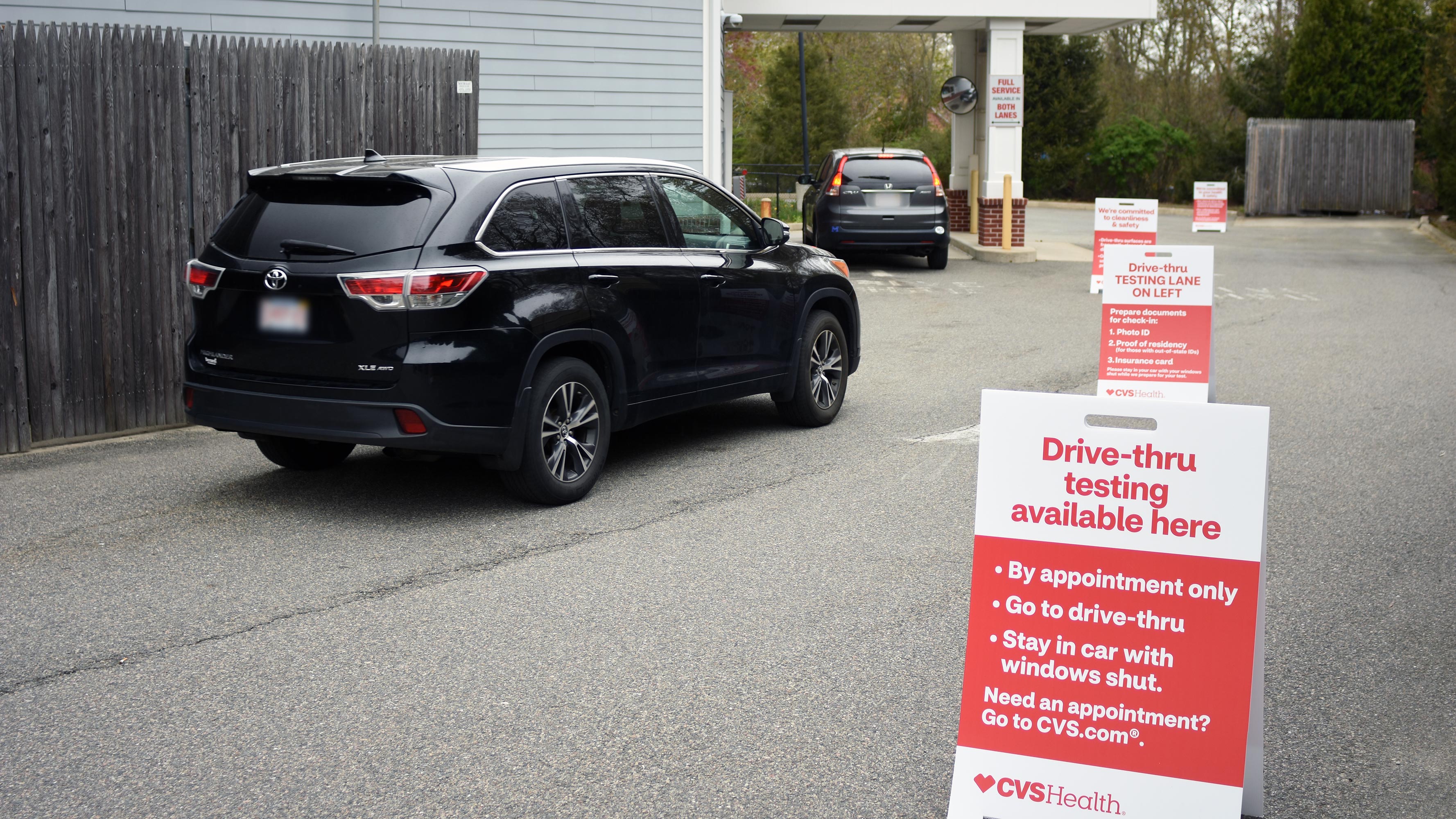 Cars in queue at a CVS Pharmacy drive-thru location, waiting to take the expanded self-swab COVID-19 test. (Available at certain locations.)