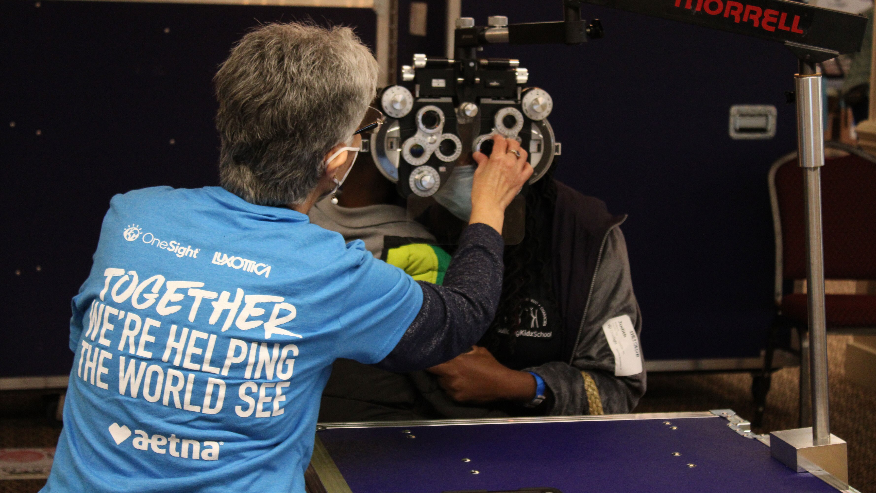 A North Atlanta resident receives an eye exam during a free clinic.