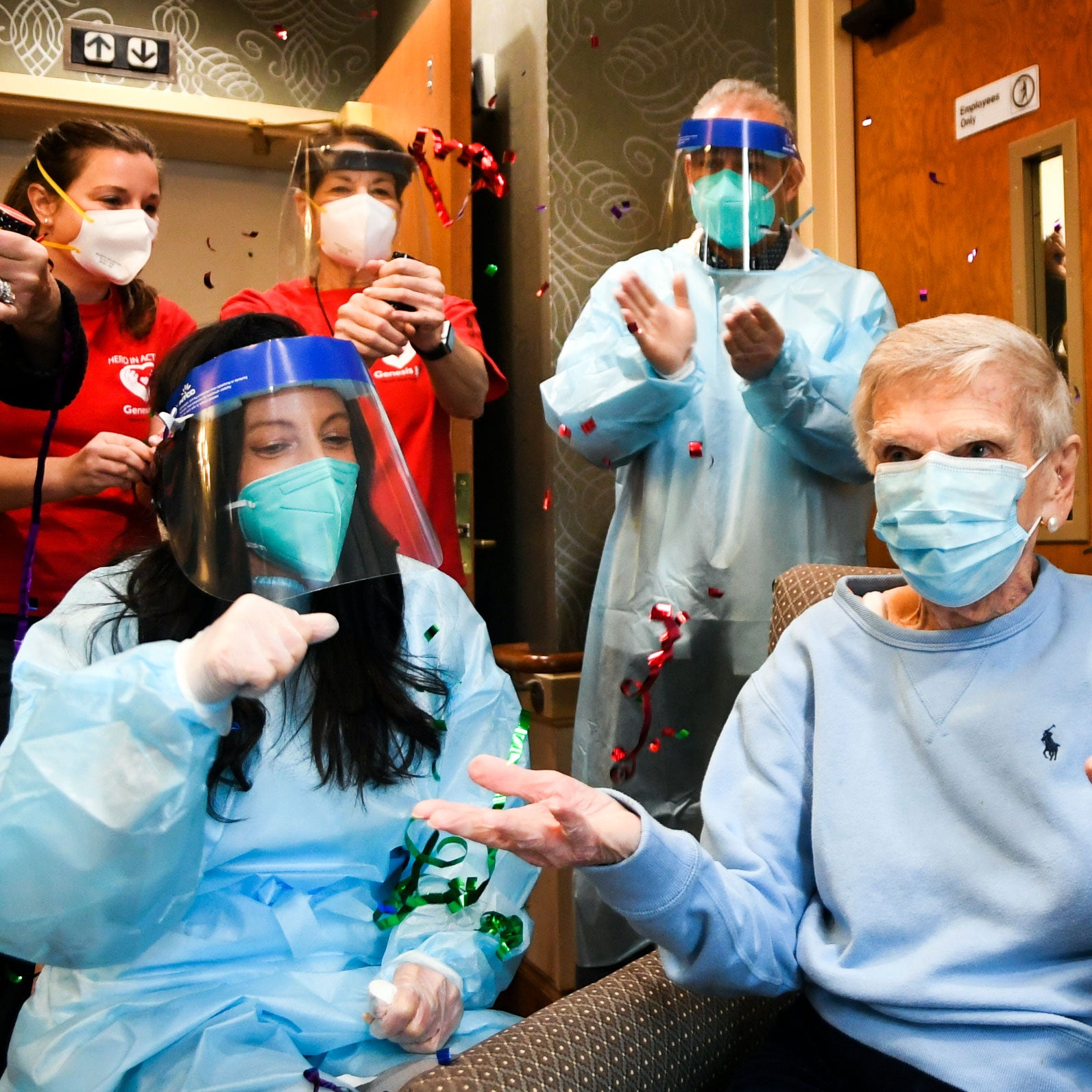 Pharmacists Bob Atighechi and MaryLou Galushko providing a COVID-19 vaccination to Reservoir resident Jeanne Peters December 18, 2020 