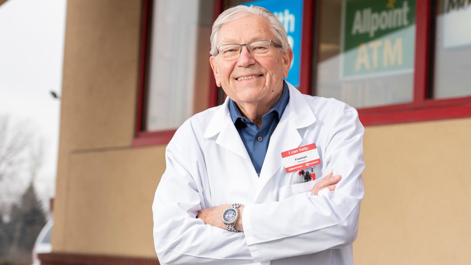 An image of Dr. Freeman Mjolsness, smiling and standing with his arms folded.