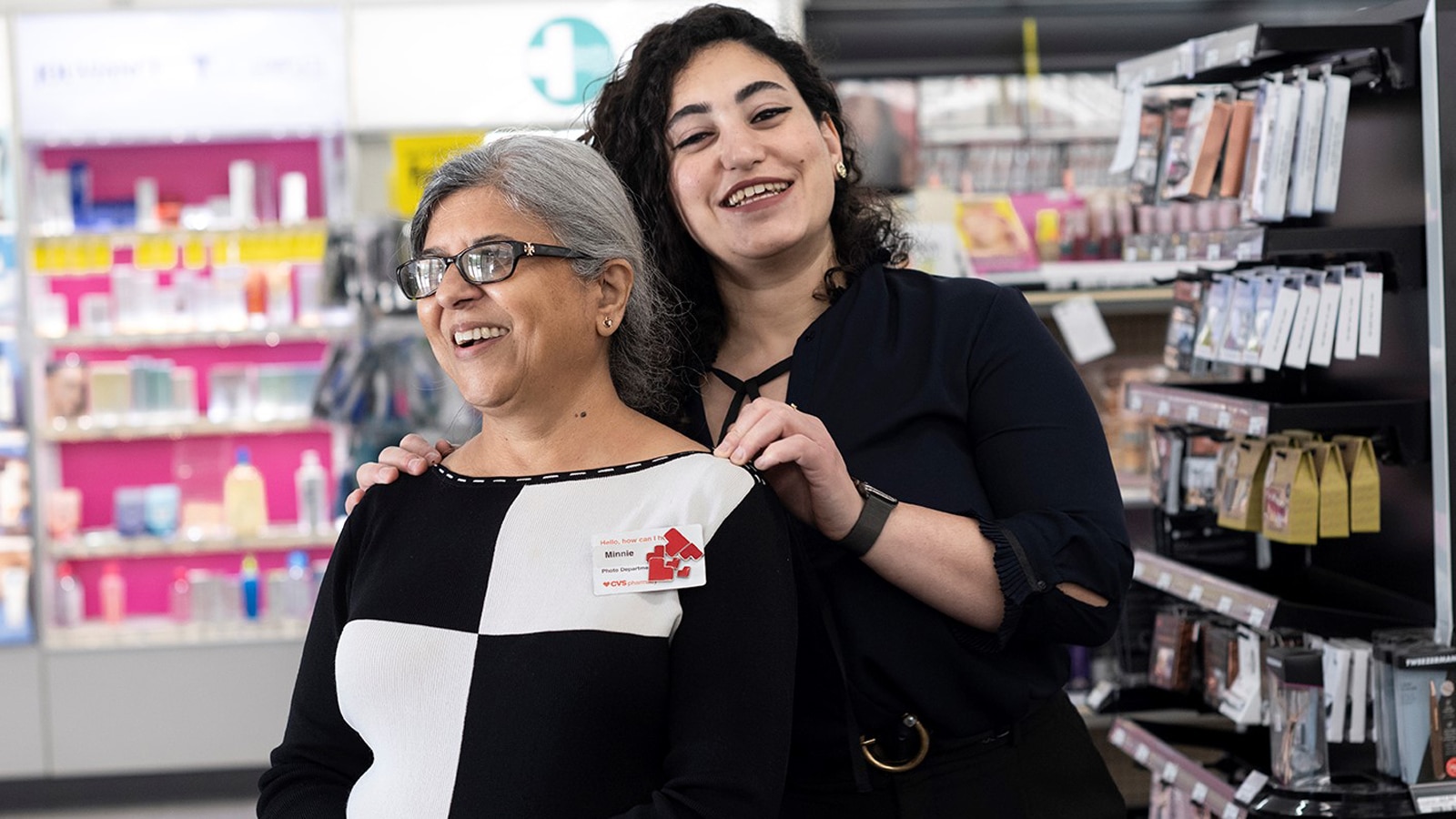 Bhamini &quot;Minnie&quot; Mewar and her manager Renwa Basiri smile in the beauty department at a CVS Pharmacy store.