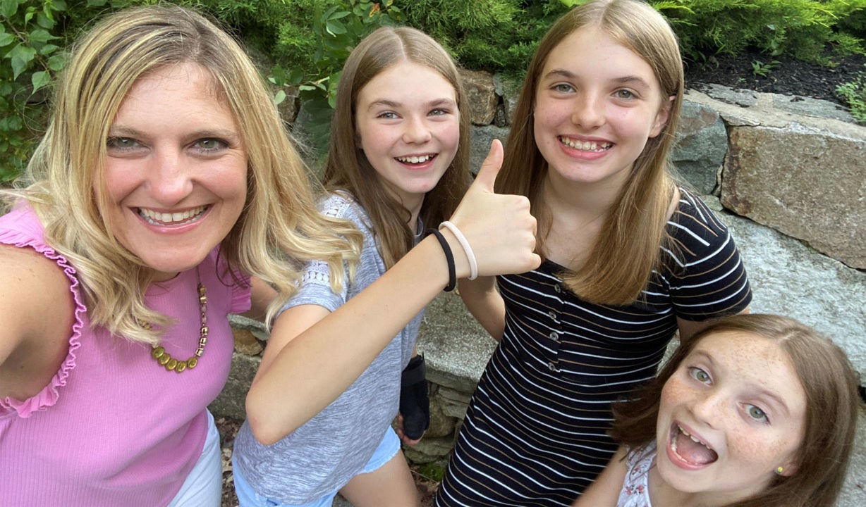 Erin posing with her daughters