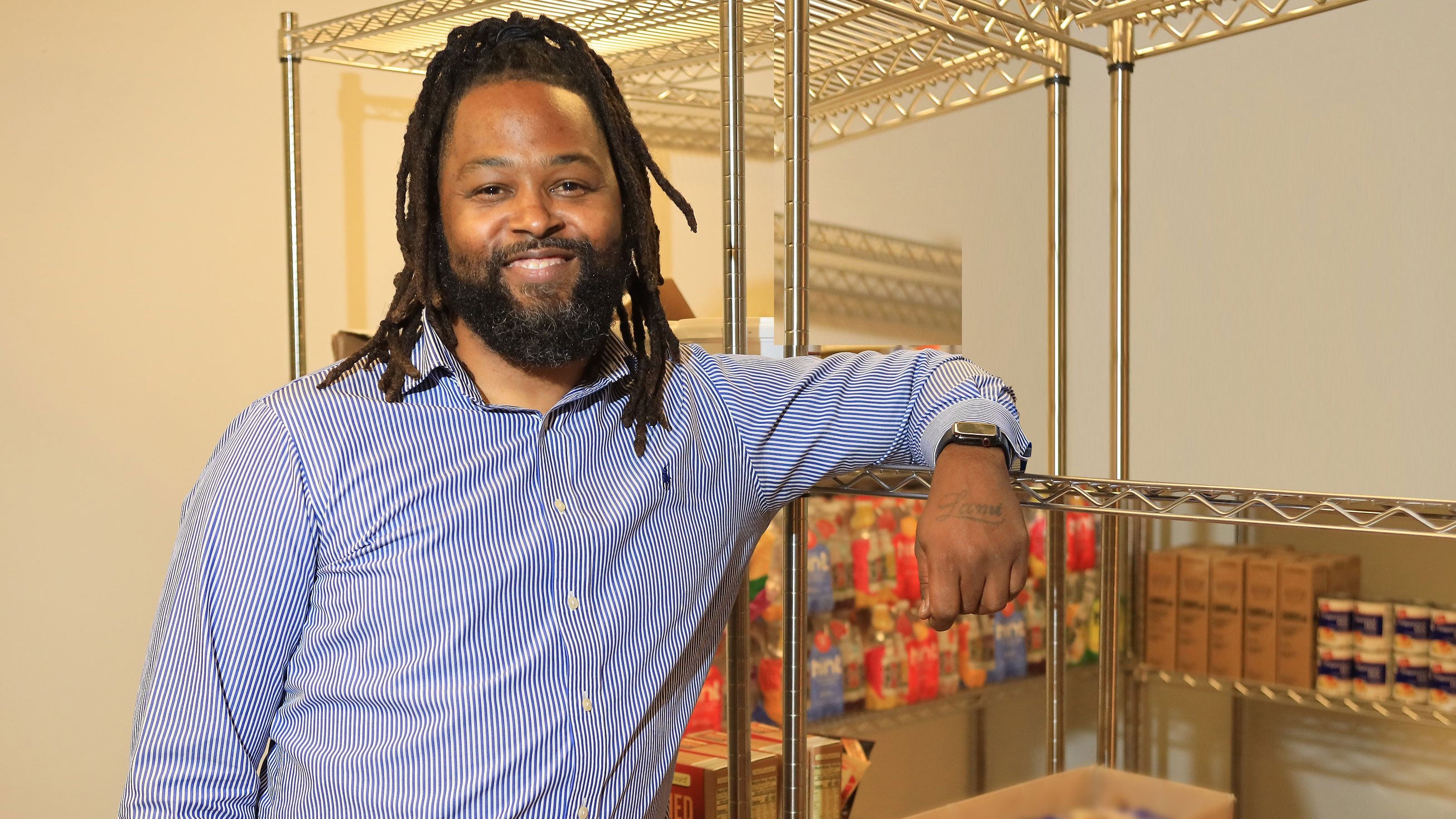 Sean Ware standing in food supply storage area