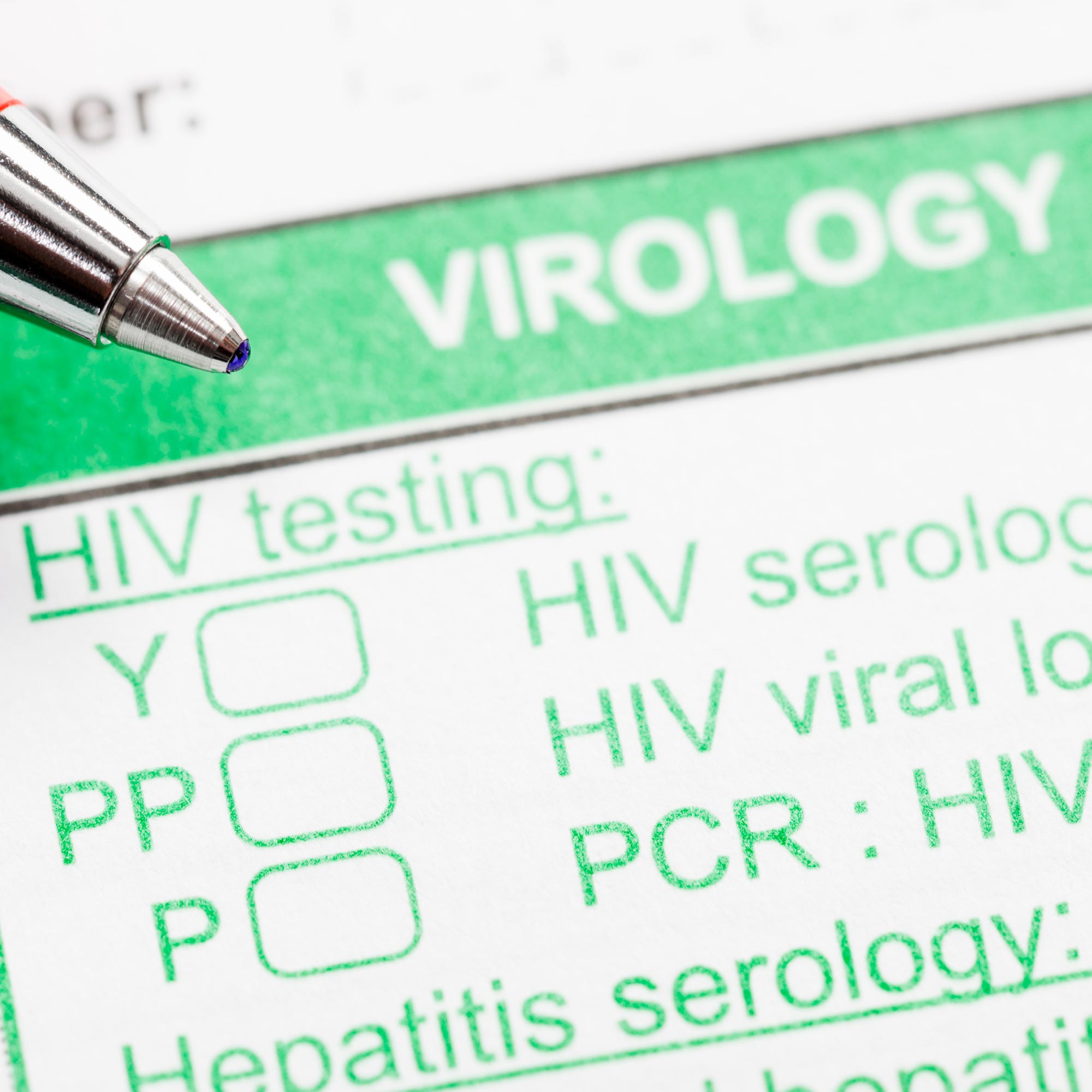 A pen hovers over the HIV testing section of a virology form.