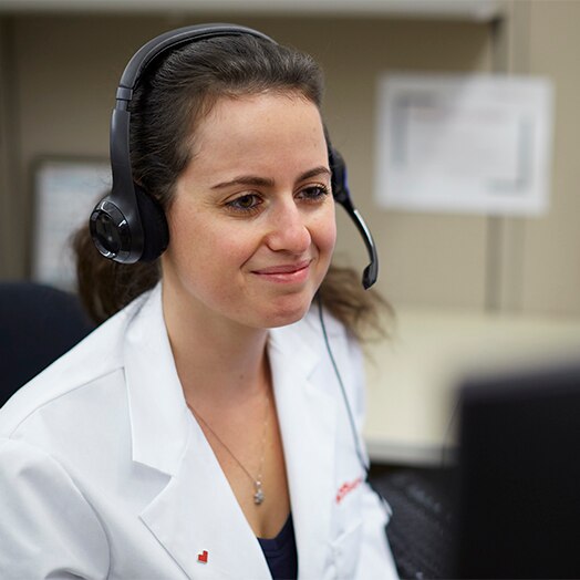 A female medical profesional talking on a headset