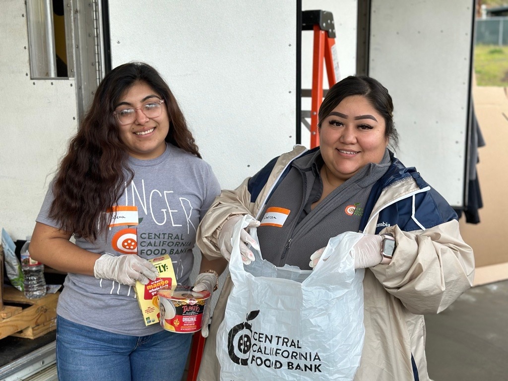 volunteers for The Central California Food Bank distribute foods donated