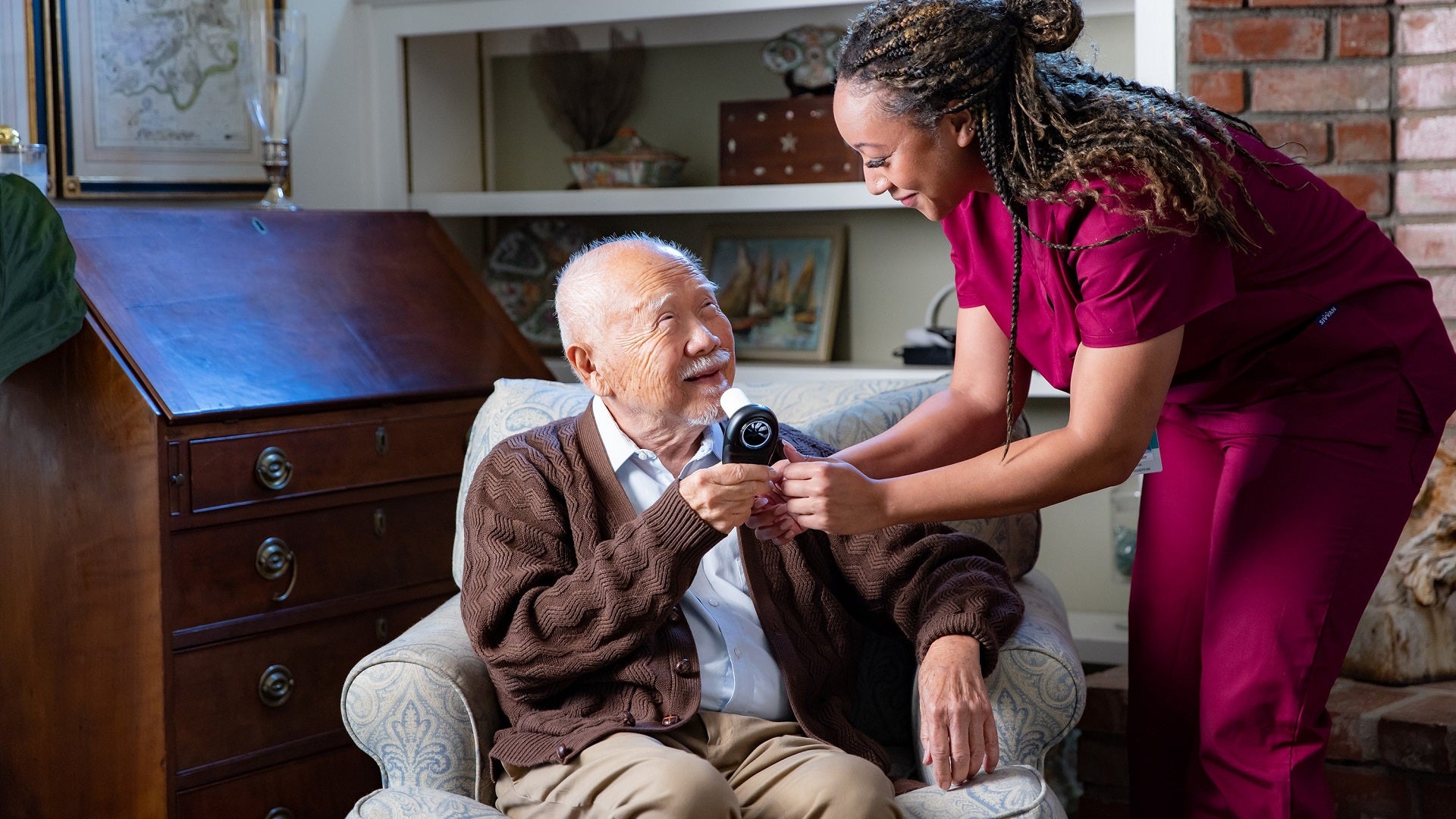 A practitioner treats a patient at home