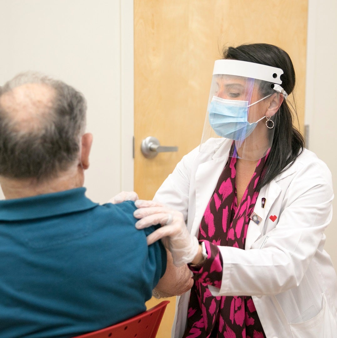 Doctor administers COVID-19 vaccine