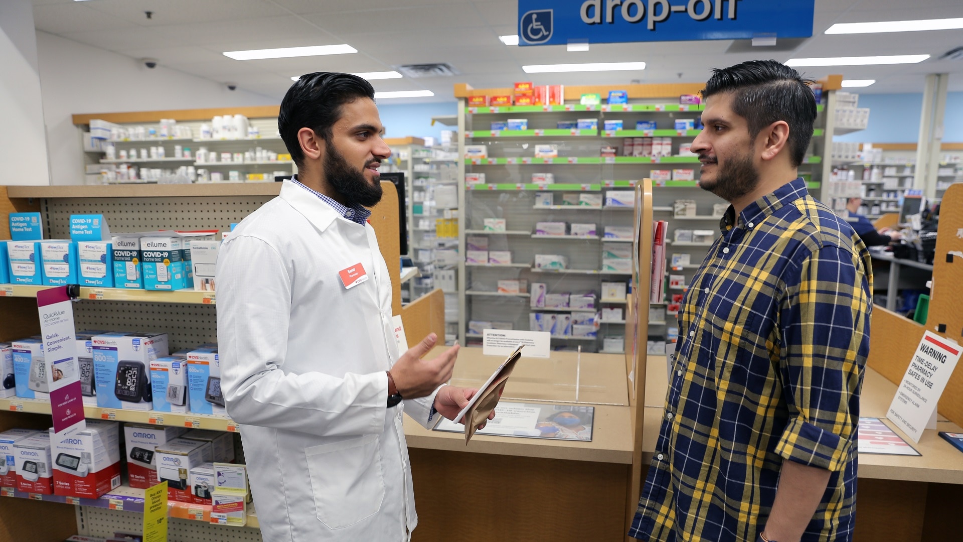 A CVS Pharmacist supporting a customer during Ramadan in conversation