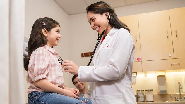 Doctor and young girl smiling