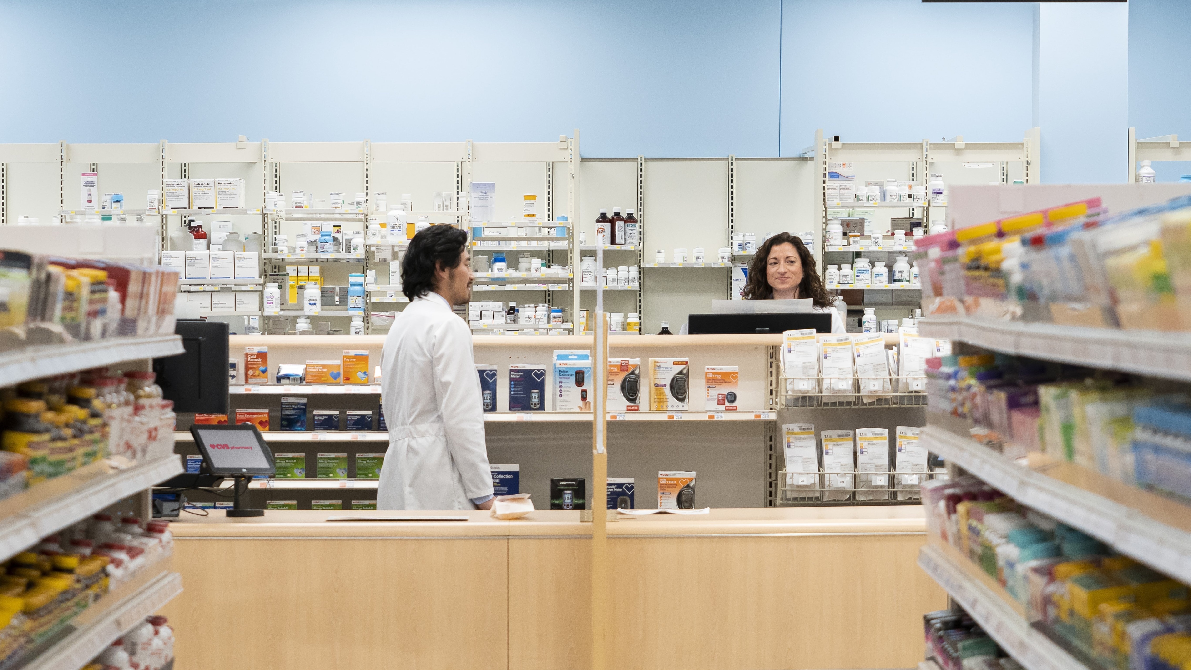 Pharmacists working at a CVS Pharmacy