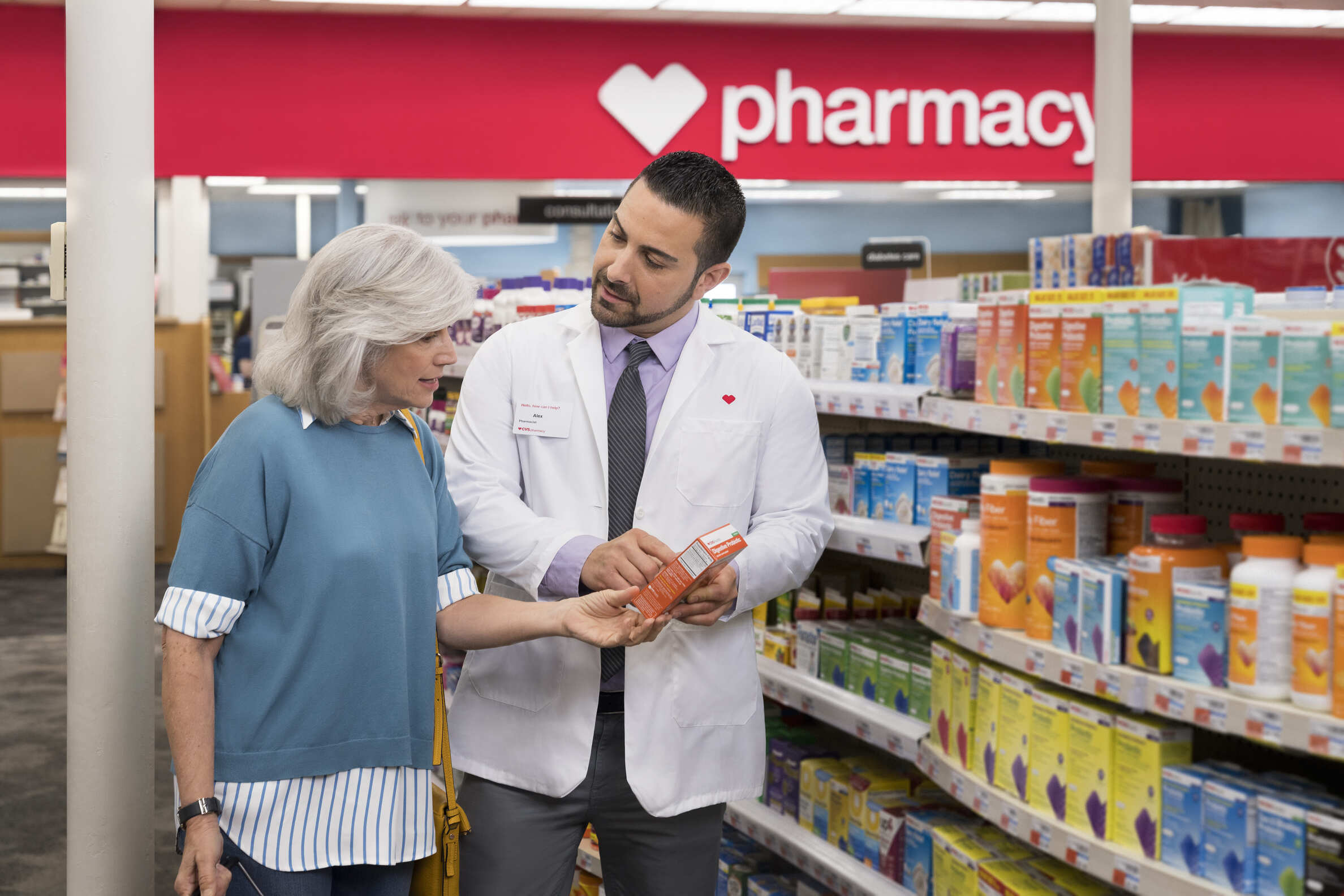 A woman talking to pharmacist