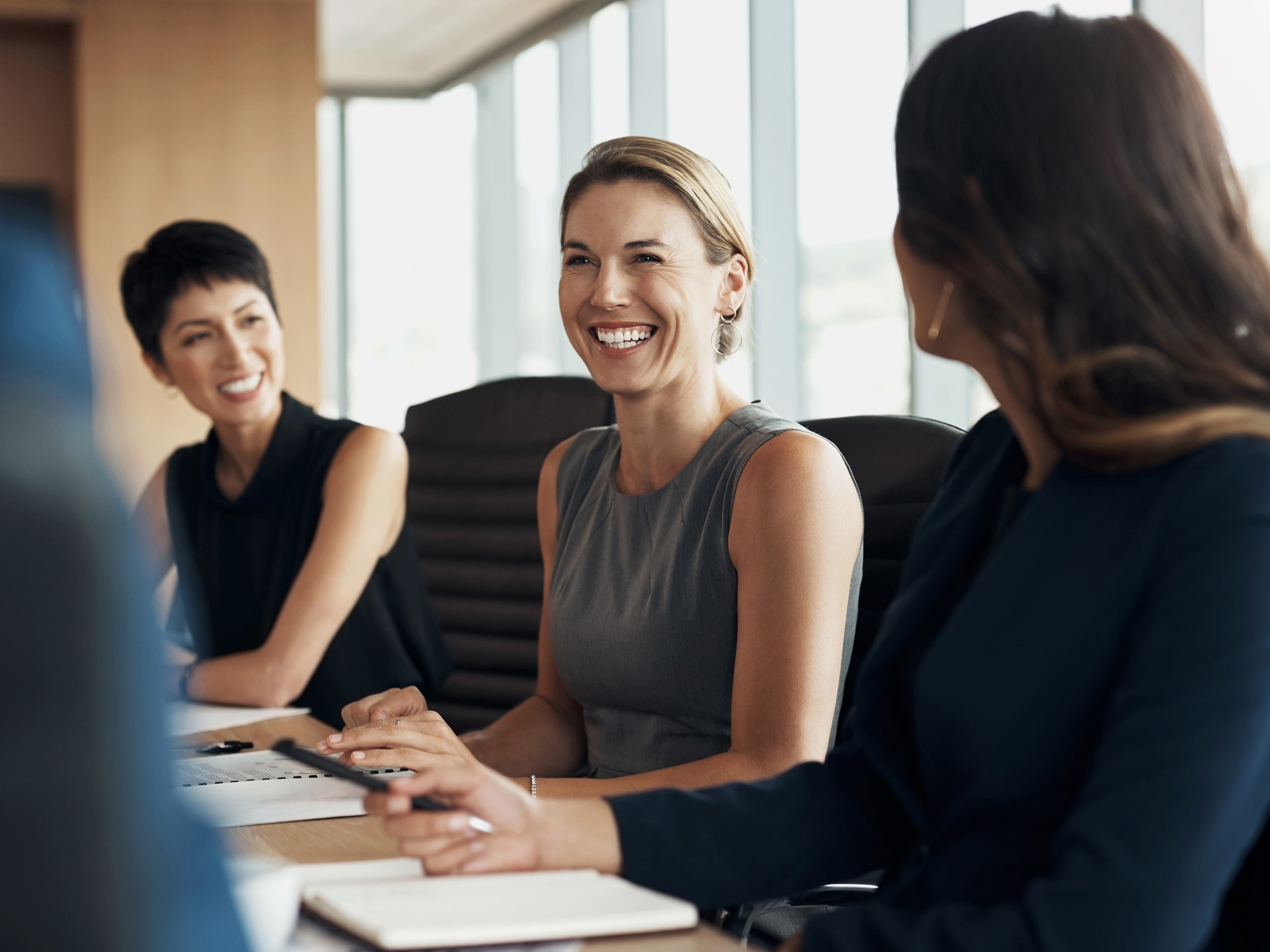 Three women in a conference room