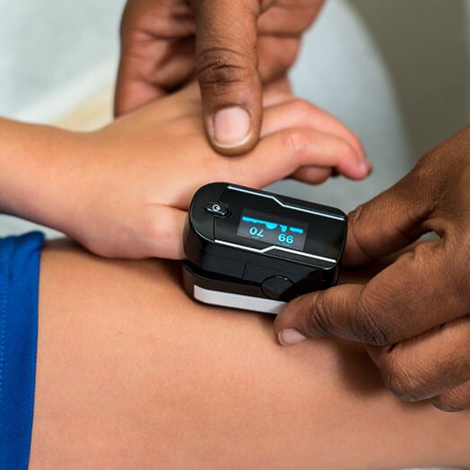 Medical professional taking patients pulse