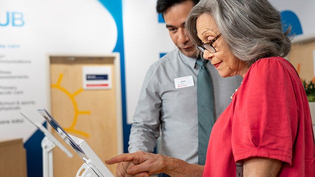 Woman using tablet at CVS Health Hub