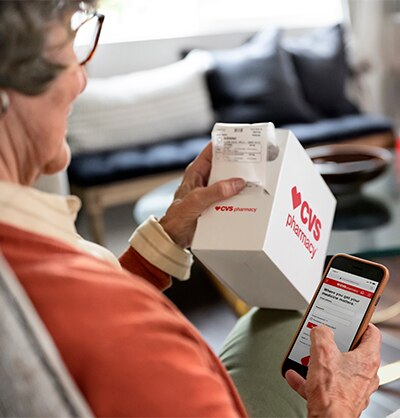 Older woman getting information for a prescription from her mobile app