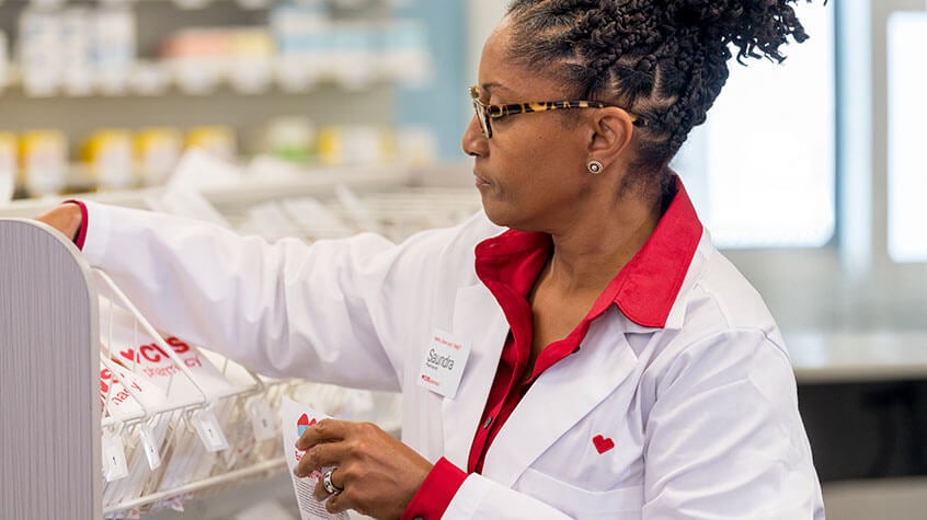Female pharmacist organizing prescriptions