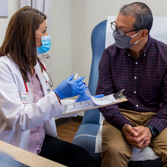 Female doctor reviewing results with male patient