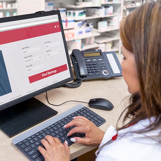 CVS pharmacist working on computer