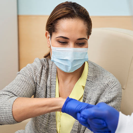 Patient and medical professional fist pumping