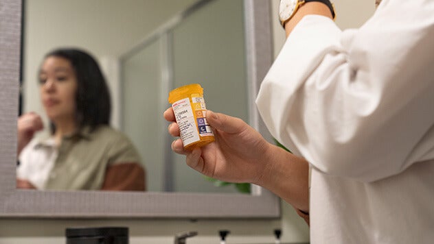 Pharmacist discussing medications with patient at CVS pharmacy