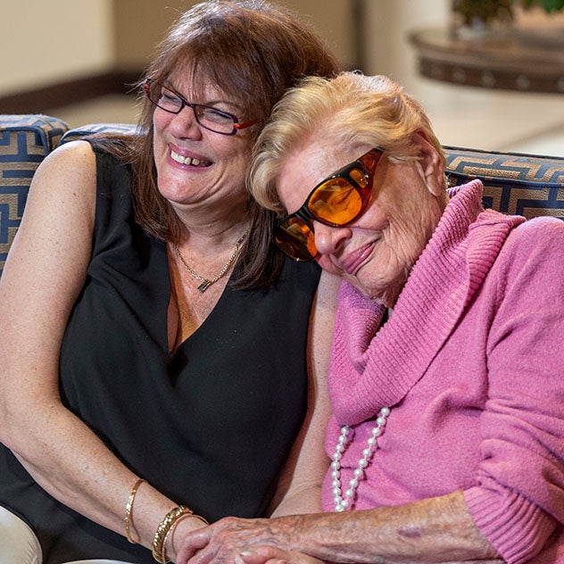 Two women comforting each other