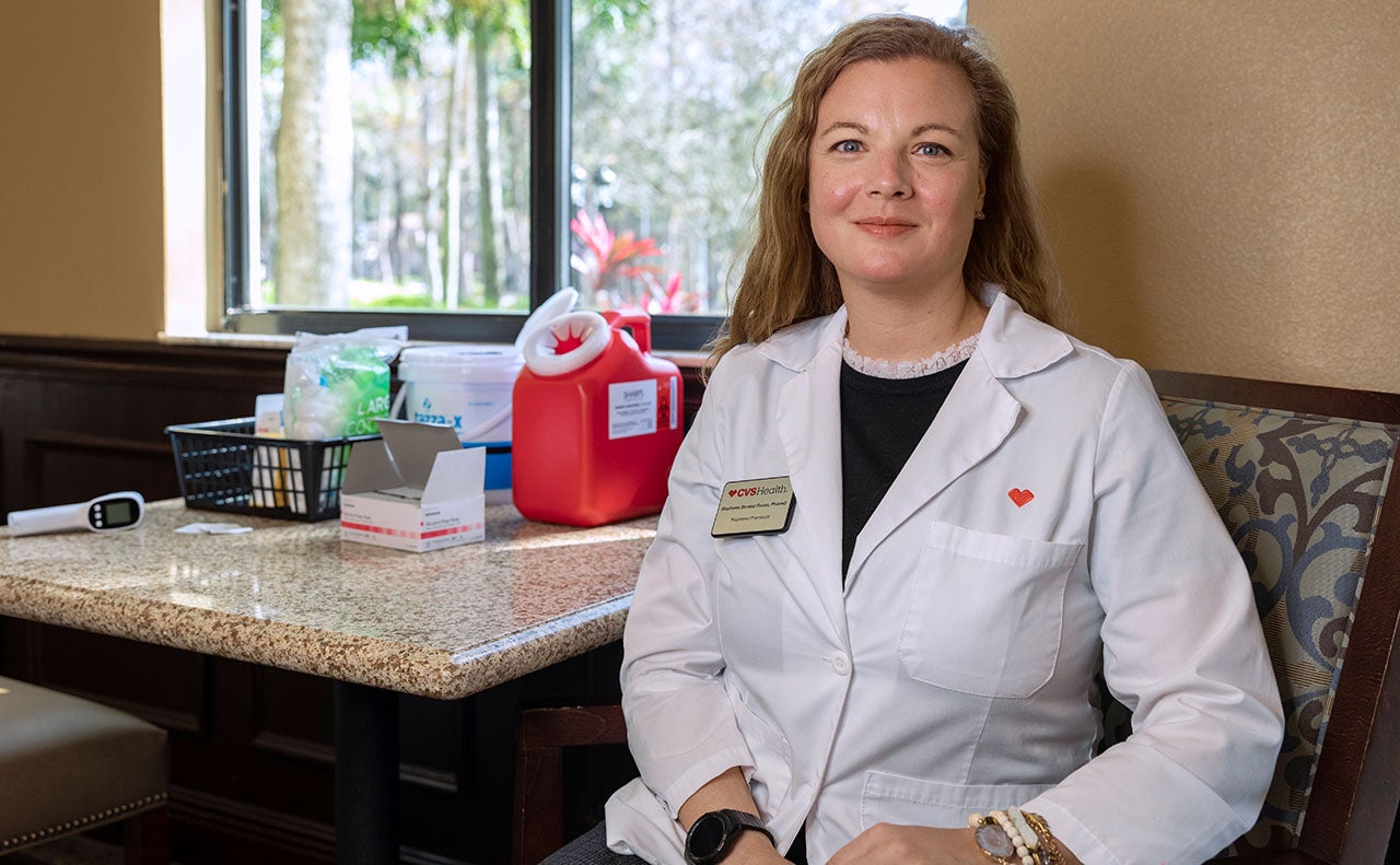 Female CVS employee smiling