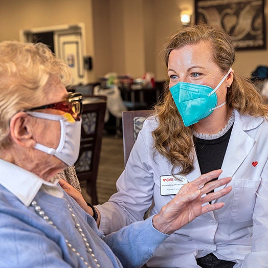 Female medical professional with female patient