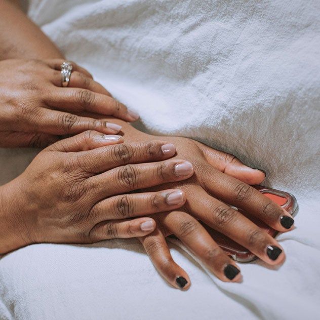 Two people holding hands