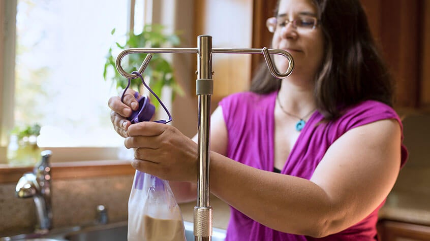 Woman at home hanging prescription